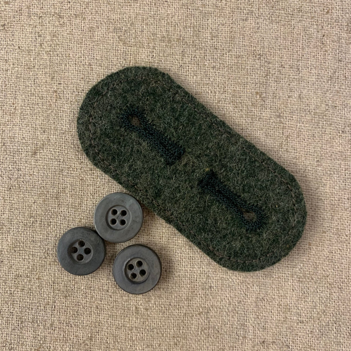 Collar attachment tab for GJ tunic